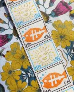 Handmade faux postage stamps made with rubber stamps