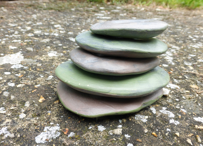 Purple and green clay stone sculptures